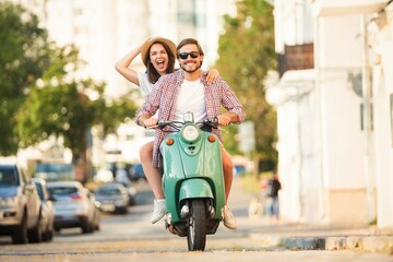 Couple in love riding a motorbike , Handsome guy and young sexy woman travel. Adventure and vacations concept. - 769484738