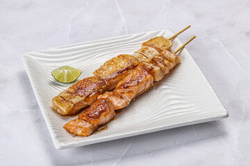 Grilled salmon skewer with sauce