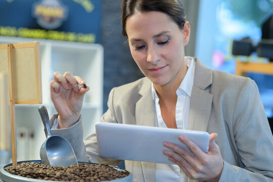 coffee worker checking the coffee beams quality - Powered by Adobe