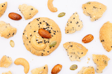 Whole Grain Cookies with crumbles and different seeds, cashew nuts, almond, black sesame, pumpkin seed on white background