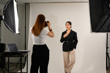 Beautiful young mode for professional photographer in photo studio