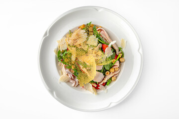 Light diet salad. Thinly sliced chicken fillet grilled with herbs on a white plate. Banquet festive dishes. Gourmet restaurant menu. White background.