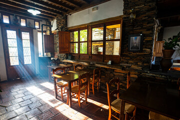 Wooden house restaurant at the moutain with light beams through the window