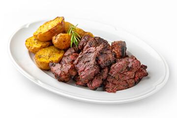 Beef or pork kebab with baked potatoes on a white plate. Banquet festive dishes. Gourmet restaurant menu. White background.
