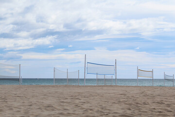 turbine on the beach, volleyball net on the beach, a beautiful view of the sandy beach with a blue sky on the sea