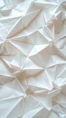 Detailed view of a white origami paper texture with folded shapes, ideal for backgrounds or wallpapers