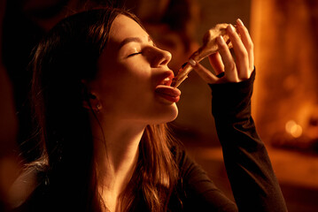 Girl with red lipstick sexy eating pizza in a pizzeria