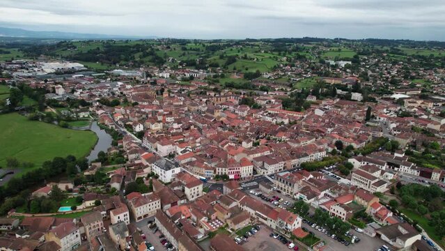 aerial view of the city of Charlieu in Forez on an overcast day ,loire department near Roanne, Auvergne Rhone Alpes Region, Home of a famous cluniac site