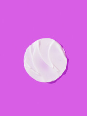 Face or body white cream, smear on colorful background