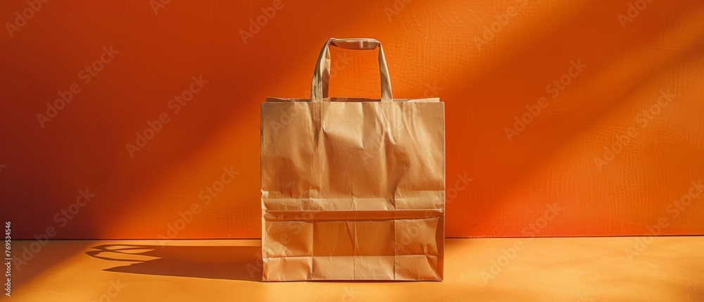 Poster A brown paper bag that can be recycled and reused on a counter. There is a printed plea for the user to use this bag again and again.