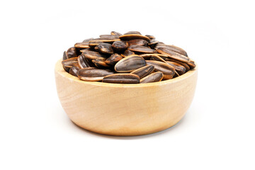 Sunflower seed in wooden bowl isolated on white background