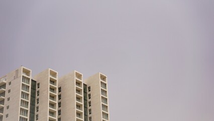 facade of modern residential building against blue sky