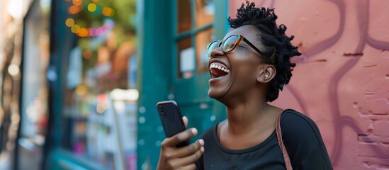 african american woman using mobile phone on the street smiling happy - 769551355