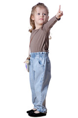 Little girl child in jeans and shirt looking showing on white background isolation