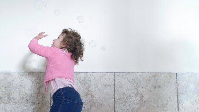 Bubble Fascination: Little Girl Mesmerized