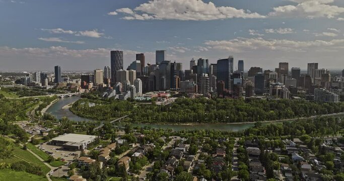 Calgary AB Canada Aerial v25 reverse flyover Sunnyside residential neighborhood capturing Bow river, Prince's Island and downtown cityscape on the skyline - Shot with Mavic 3 Pro Cine - July 2023