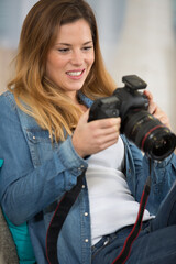 photographer in office checking picture