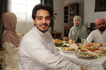 Fototapeta na wymiar Cheerful Young Middle Eastern Man At Festive Dinner Portrait