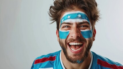 Happy sports fan with blue striped face paint and a joyful expression.