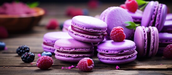 Obraz na płótnie Canvas Delight your taste buds with purple macarons topped with fresh raspberries and blackberries displayed on a rustic wooden table, a sweet and colorful dessert perfect for any occasion