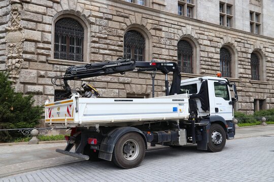 LEIPZIG, GERMANY - MAY 9, 2018: Man truck with Hiab XS 111 truck crane parked next to construction site in Germany.
