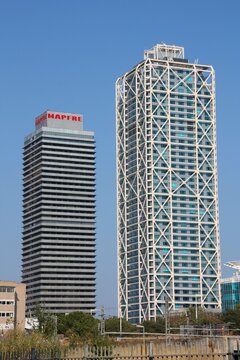 BARCELONA, SPAIN - SEPTEMBER 10, 2009: Skyscrapers view in Barcelona, Spain. Iconic duo: Hotel Arts and Torre Mapfre are the tallest skyscrapers in Barcelona.