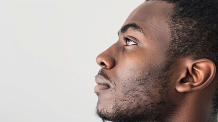 Obraz premium side profile of african man white background