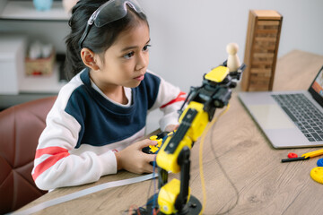 Asian girls were learning robot programming and getting lessons control on robot arms. Laboratory....