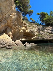 Mediterranean sea pebbles beach and rocks - obrazy, fototapety, plakaty