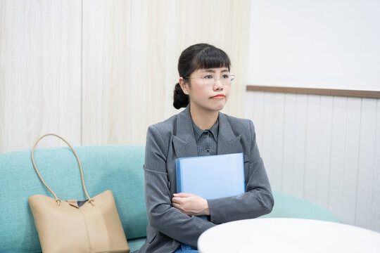 Middle-aged female job seeker waiting for interview