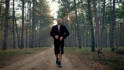 Male pervert in park, man exhibitionist opens coat in forest. Psychological disorders, sexual upbringing issues, emotional disturbances, depression