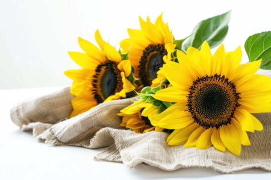 Beautiful sunflower on light linen cloth, white background