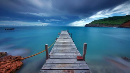 Poster wooden jetty extending into the serene waters of the Lake District, with distant mountains © jiawei