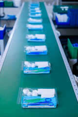 Medical instruments Kit surgery on conveyor line, top view. Factory production for equipment of med clinic