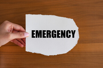 Emergency. Woman hand holds a piece of paper with a note, emergency. First care, incident, first...