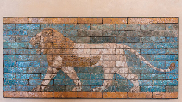 Walking lion. Fragment of decorative glazed siliceous bricks wall panel from the Palace of king Darius in Susa. July 10, 2019. Louvre, Paris, France