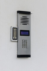 Intercom with camera on the wall of the house