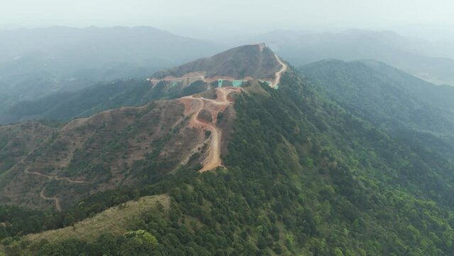 Windmill foundation, AERIAL, Wind turbine foundation built in the mountains of China. Green energy production, scenic windmill, sustainability of nature, caring for the environment and nature