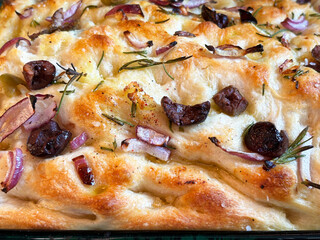 Close-up of a fresh baked loaf of focaccia.
