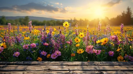 Deurstickers A vibrant field filled with a multitude of colorful flowers swaying gently in the breeze as the sun sets in the background, casting a warm golden glow over the landscape © nnattalli
