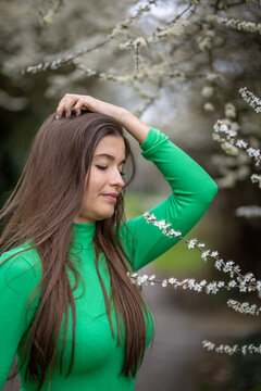 Young Woman in Green Top in the Park