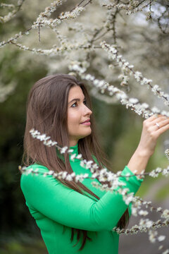 Young Woman in Green Top in the Park