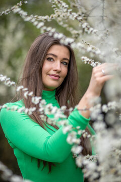 Young Woman in Green Top in the Park