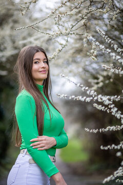 Young Woman in Green Top in the Park