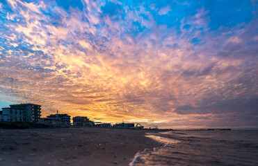 Obraz premium Sunset on the Rimini beach, Italy