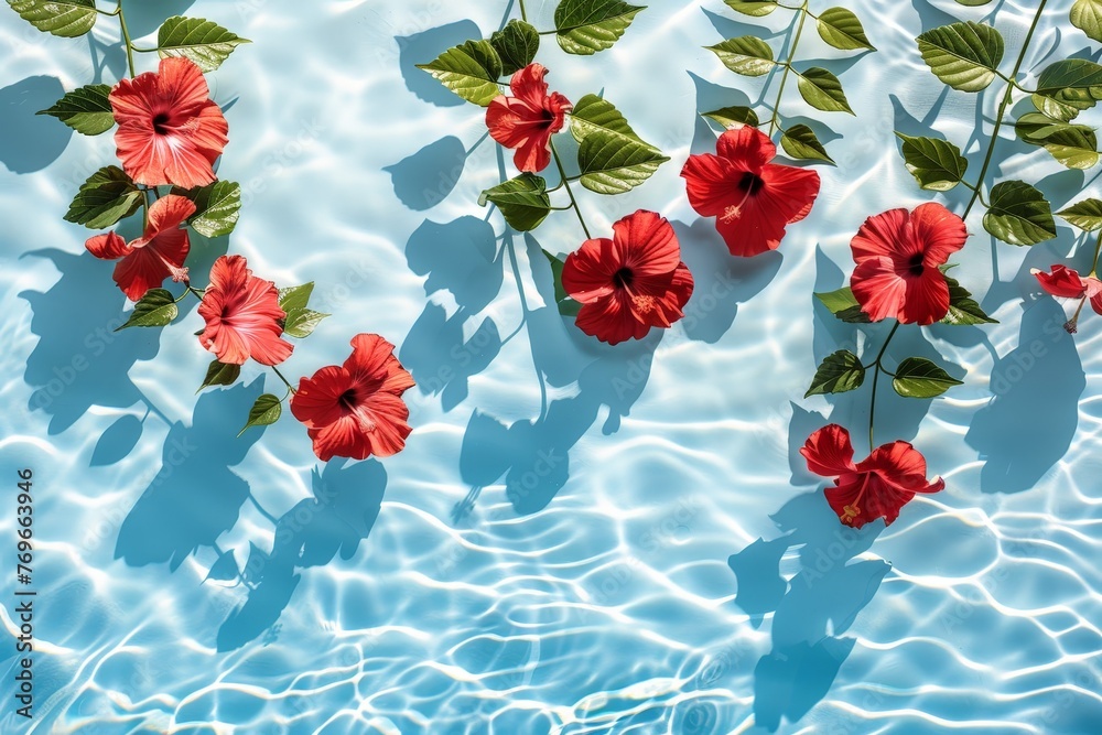 Aufkleber a vibrant group of red flowers gracefully float on the surface of a tranquil pool, creating a mesmer