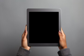 a person holding a tablet