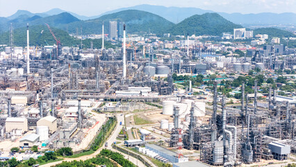 Fototapeta na wymiar Aerial top view oil and gas refinery background, Business petrochemical industrial, Refinery oil and gas factory power and fuel energy, Ecosystem estates. Fuel refinery industry