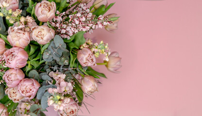 Chic bouquet of pink tulips on a pink background