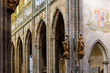 The vaulted ceilings and gothic arches of Saint Vitus Cathedrals interior are showcased, accented...